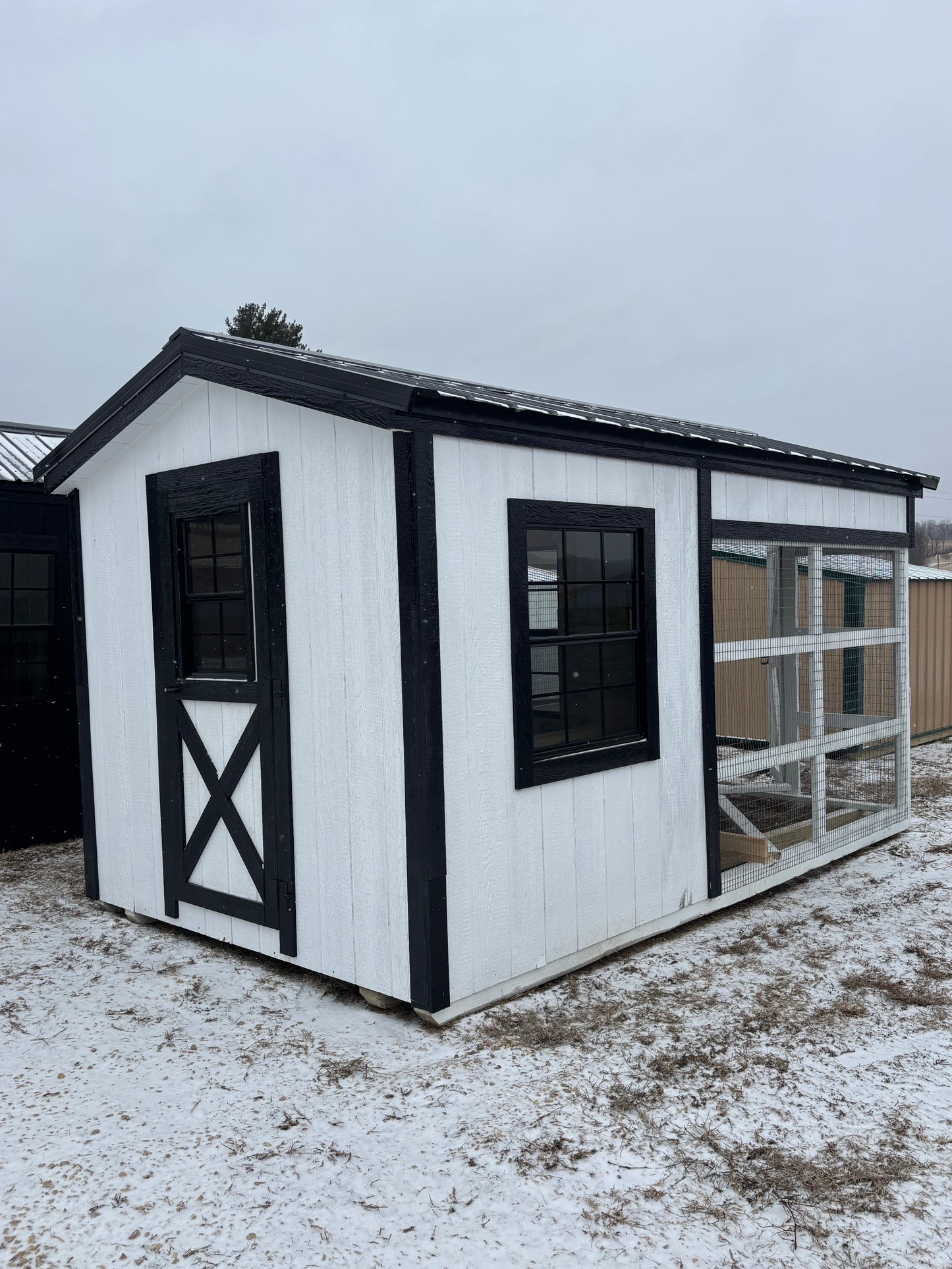 Country style chicken coop in LP smart siding. 8’x 14’