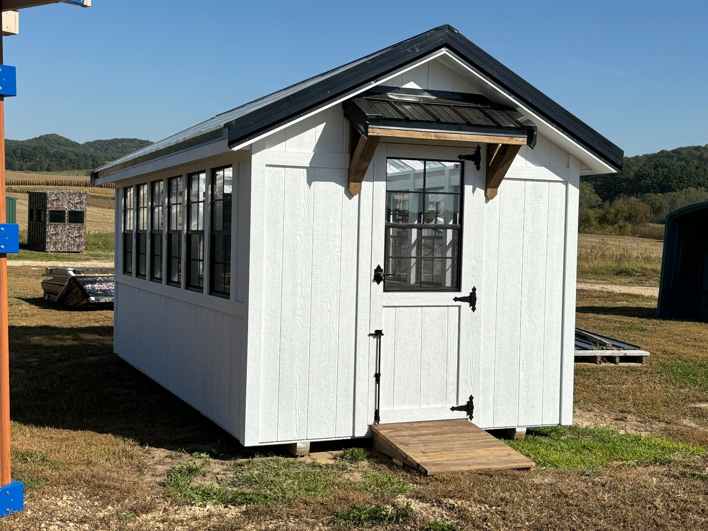 8 x 16 greenhouse white with black windows and timber frame awning and ramp