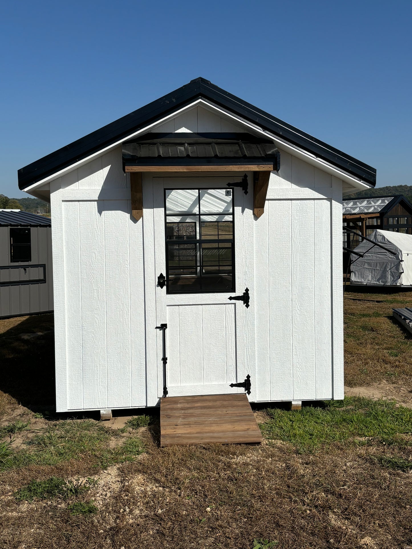 8 x 16 greenhouse white with black windows and timber frame awning and ramp