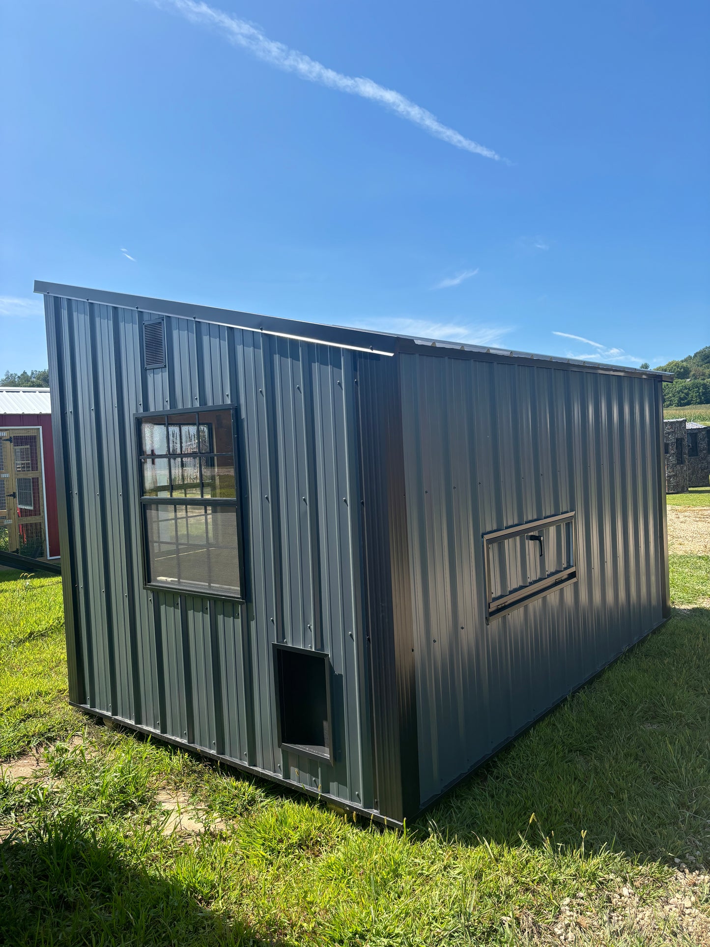 8x12 homestead chicken coop in charcoal blue with black roof and trim