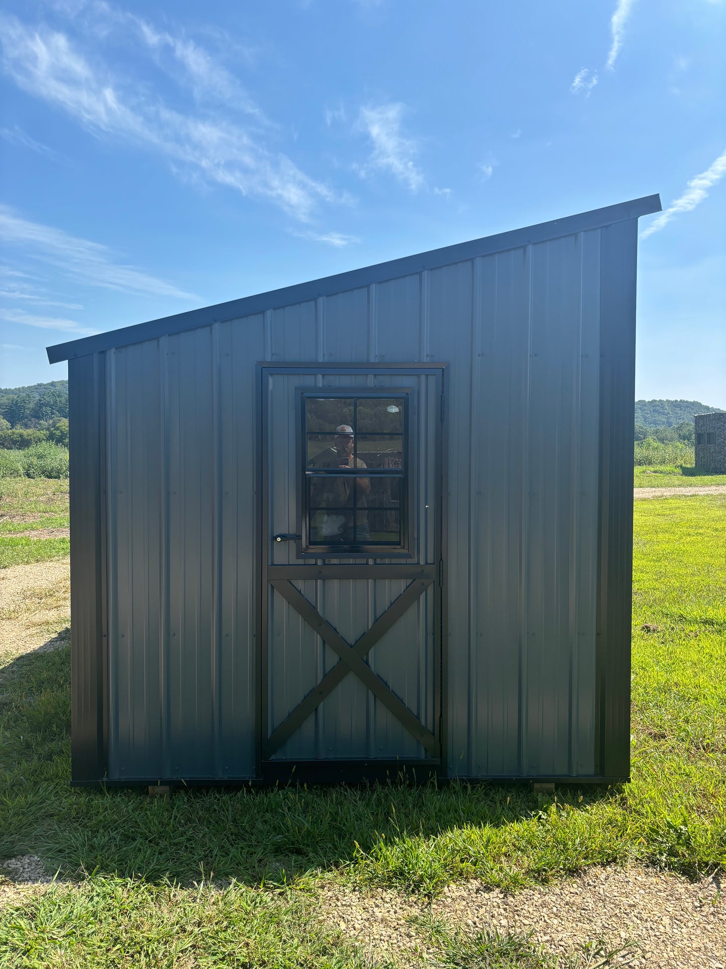 8x12 homestead chicken coop in charcoal blue with black roof and trim